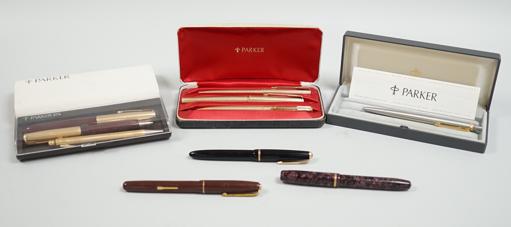 A Parker gold plated pen/pencil biro set and other Parker pens